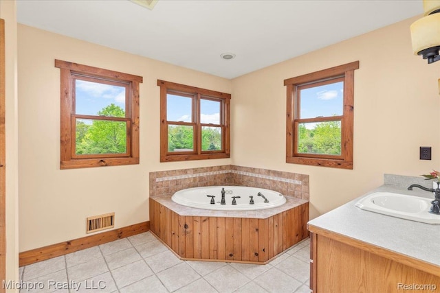 3434 Brown City Rd, Imlay City, MI 48444 - full bath with a garden tub, tile patterned floors, baseboards, and vanity