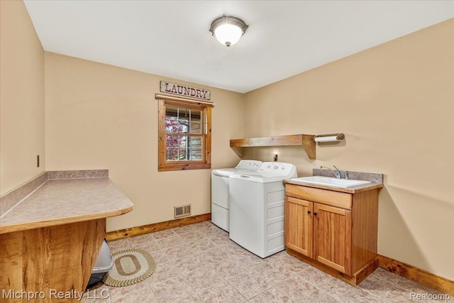 3434 Brown City Rd, Imlay City, MI 48444 - laundry area featuring washing machine and clothes dryer, cabinet space, and baseboards
