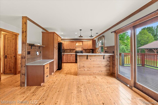 3434 Brown City Rd, Imlay City, MI 48444 - kitchen with black appliances, light countertops, a peninsula, light wood-style flooring, and recessed lighting