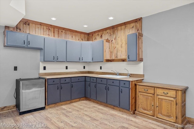 3434 Brown City Rd, Imlay City, MI 48444 - kitchen featuring a sink, light wood-type flooring, light countertops, recessed lighting, and fridge