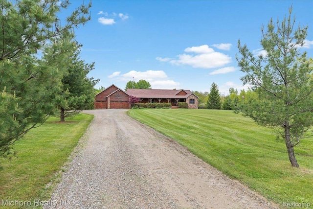 3434 Brown City Rd, Imlay City, MI 48444 - ranch-style house featuring dirt driveway, a front yard, and an attached garage