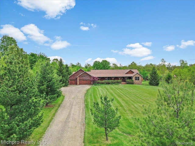 3434 Brown City Rd, Imlay City, MI 48444 - ranch-style house featuring dirt driveway, a front lawn, and a garage