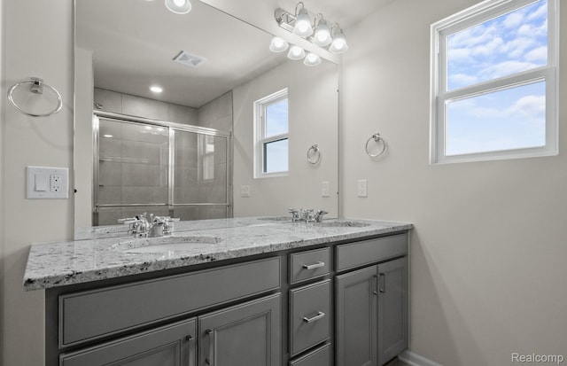 4060 Nottingham Cir, Clarkston, MI 48346 - bathroom with double vanity, a tile shower, and recessed lighting