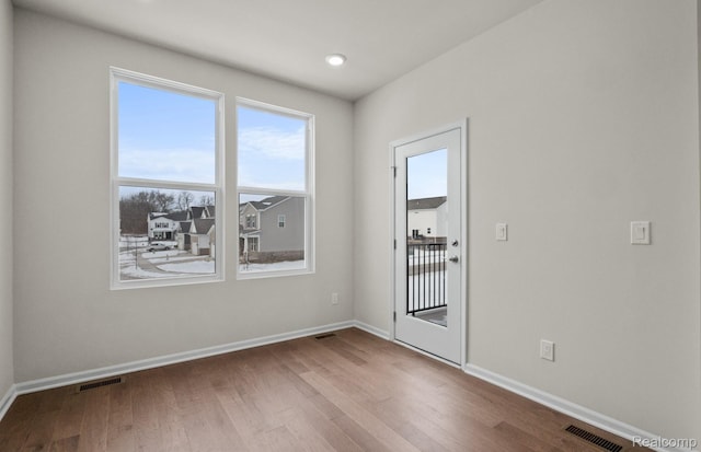 4060 Nottingham Cir, Clarkston, MI 48346 - unfurnished room featuring wood finished floors and baseboards