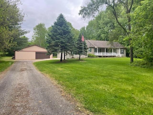 11525 N Meridian Rd, Pleasant Lake, MI 49272 - ranch-style house with a front lawn, an outdoor structure, covered porch, and a garage