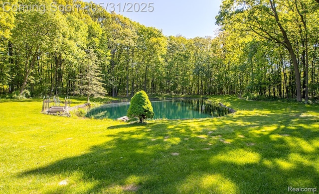 8210 Pine Ridge Dr, Clarkston, MI 48346 - view of grassy yard with a wooded view and a water view