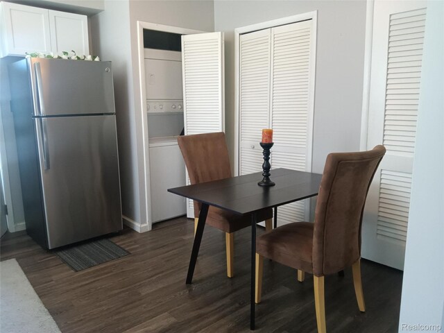 3246 Harris St, Ferndale, MI 48220 - dining room with stacked washer / drying machine, dark wood-style floors, baseboards, and a desk