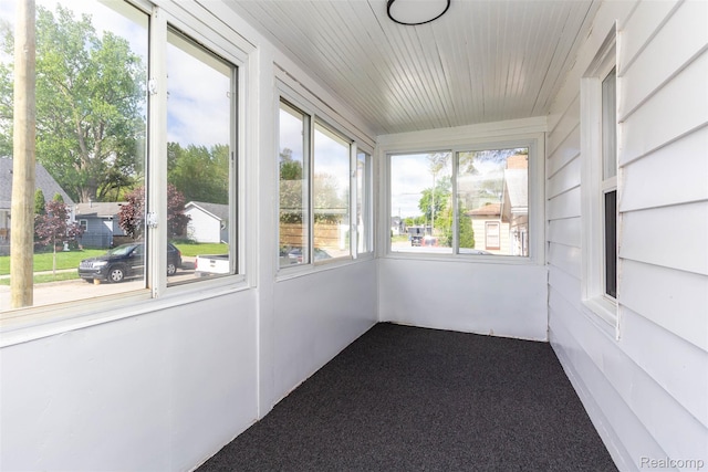8713 Hupp Ave, Warren, MI 48089 - unfurnished sunroom featuring carpet flooring and wood ceiling
