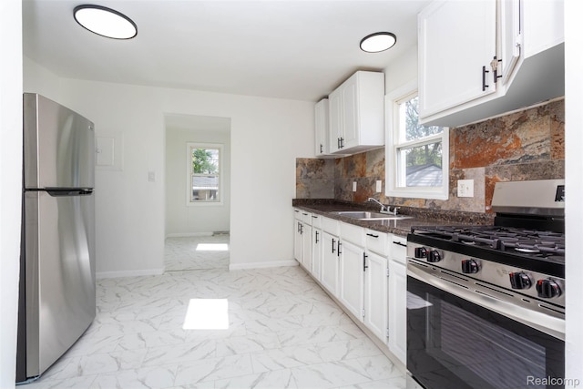 8713 Hupp Ave, Warren, MI 48089 - kitchen featuring appliances with stainless steel finishes, light marble finish floors, a sink, and white cabinets