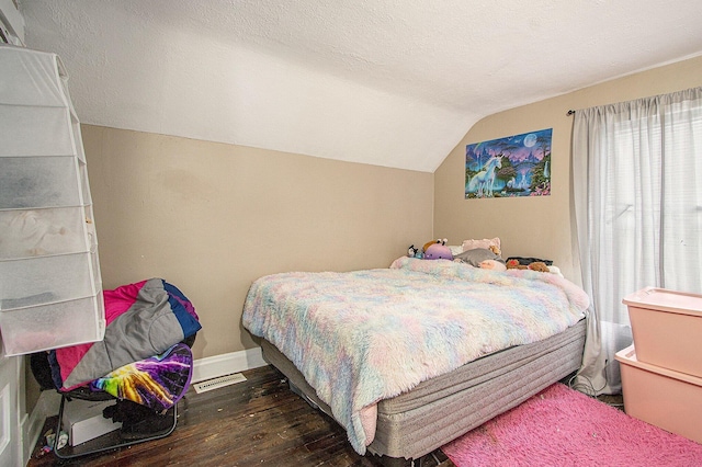 2149 Luella St, Kalamazoo, MI 49001 - bedroom with vaulted ceiling, wood-type flooring, and baseboards
