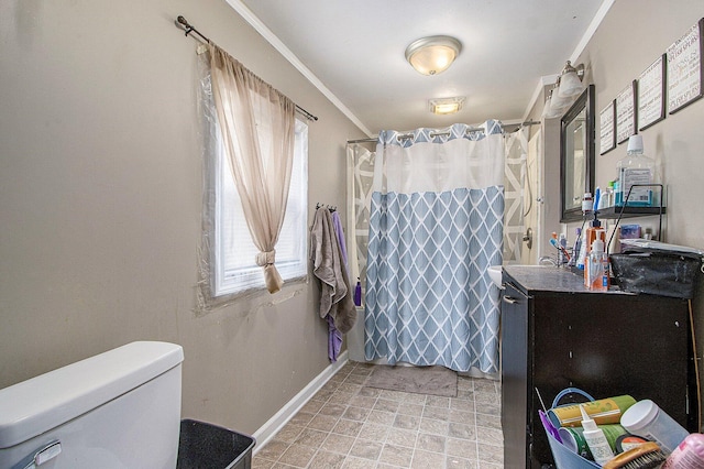 2149 Luella St, Kalamazoo, MI 49001 - full bath with vanity, toilet, baseboards, a shower with shower curtain, and ornamental molding