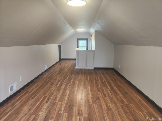 428 E Milton Ave, Hazel Park, MI 48030 - additional living space with wood finished floors, lofted ceiling, and baseboards