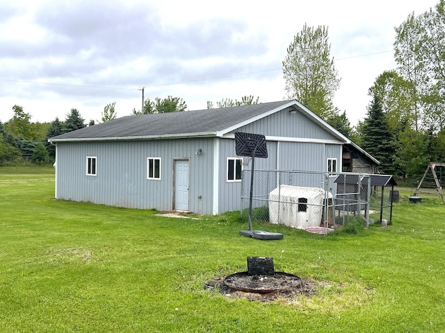 132 W Lansing Rd, Morrice, MI 48857 - back of property featuring an outbuilding and a yard