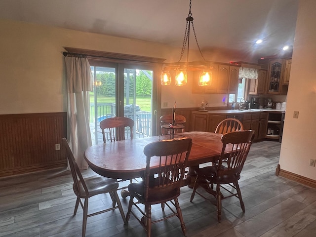 132 W Lansing Rd, Morrice, MI 48857 - dining space featuring dark wood-style flooring and a wainscoted wall