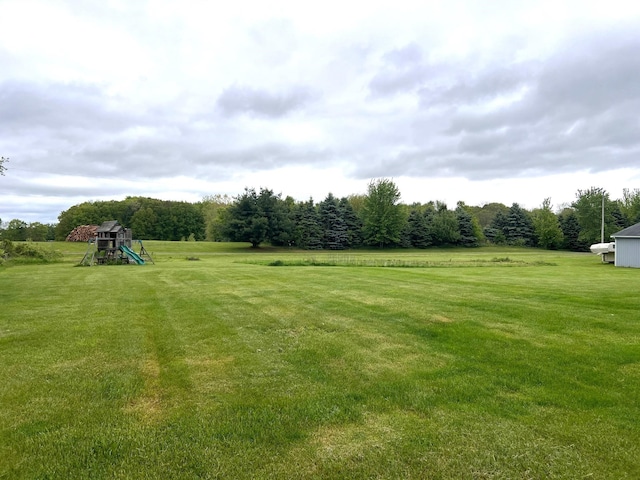 132 W Lansing Rd, Morrice, MI 48857 - view of green lawn featuring a playground