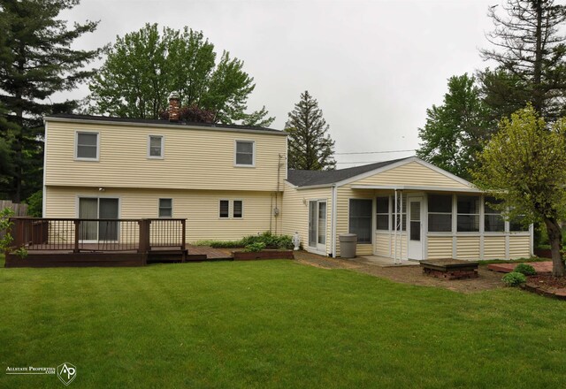 3478 N Gale Rd, Davison, MI 48423 - rear view of property with a sunroom, a wooden deck, a yard, and a chimney