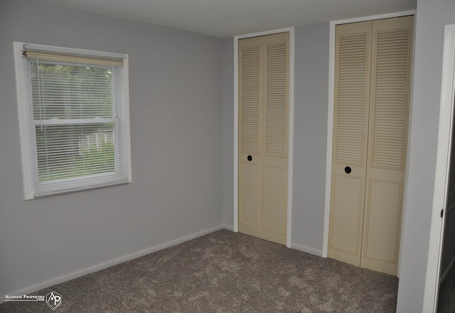 3478 N Gale Rd, Davison, MI 48423 - unfurnished bedroom featuring two closets, carpet, and baseboards