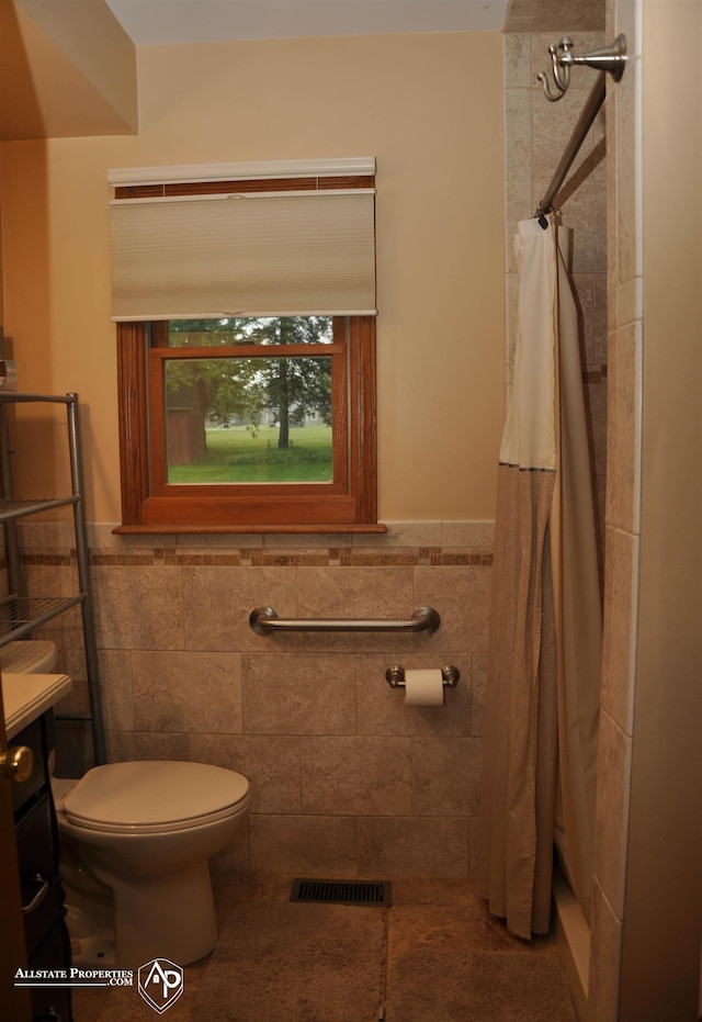 3478 N Gale Rd, Davison, MI 48423 - full bath with tile walls, toilet, a shower with curtain, vanity, and wainscoting