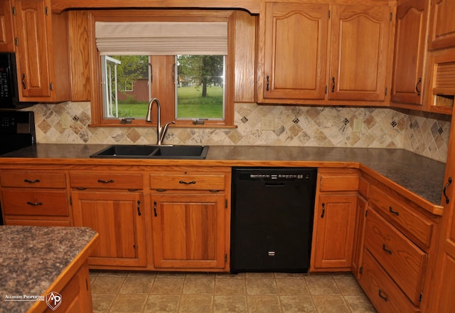 3478 N Gale Rd, Davison, MI 48423 - kitchen with black appliances, a sink, and dark countertops