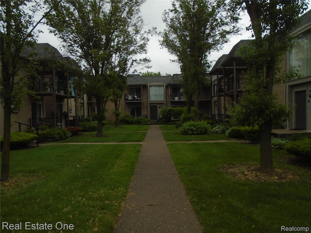 1727 E 14 Mile Rd Unit A, Birmingham, MI 48009 - surrounding community featuring a lawn
