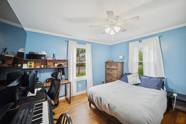 514 Granada Ave, Saint Joseph, MI 49085 - bedroom featuring multiple windows, wood finished floors, an office area, baseboards, and ornamental molding