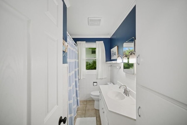 514 Granada Ave, Saint Joseph, MI 49085 - bathroom with tile patterned flooring, toilet, vanity, ornamental molding, and tile walls