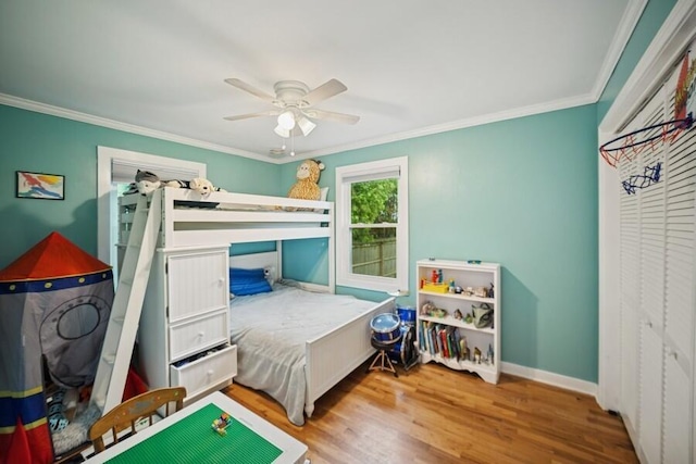 514 Granada Ave, Saint Joseph, MI 49085 - bedroom with wood finished floors, crown molding, ceiling fan, and baseboards