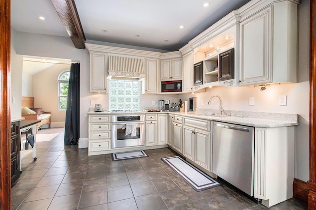 110 N O Keefe St, Cassopolis, MI 49031 - kitchen featuring stainless steel appliances, a sink, light stone countertops, open shelves, and dark tile patterned floors