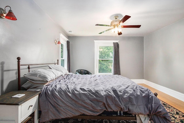 110 N O Keefe St, Cassopolis, MI 49031 - bedroom with wood finished floors, baseboards, and ceiling fan
