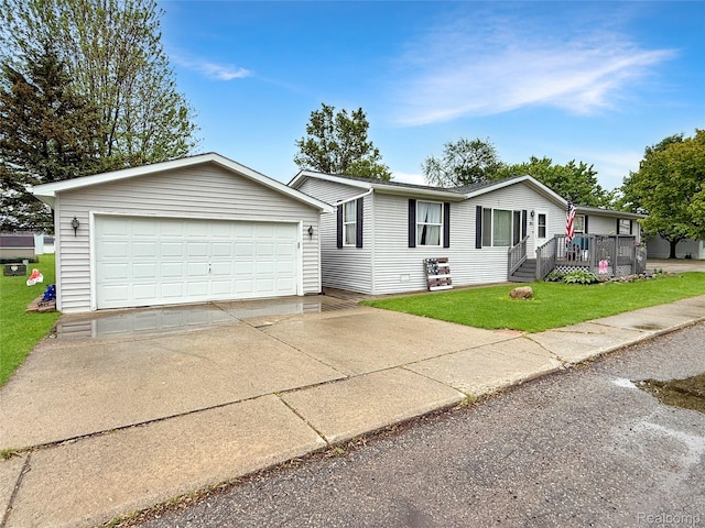 91 Sangam Pl, Swartz Creek, MI 48473 - view of front of home featuring a front yard, driveway, and an attached garage