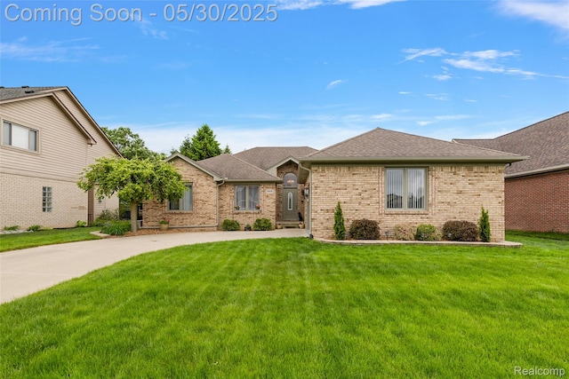 16106 Nathan Dr, Macomb, MI 48044 - view of front of house with brick siding, a front yard, and a shingled roof