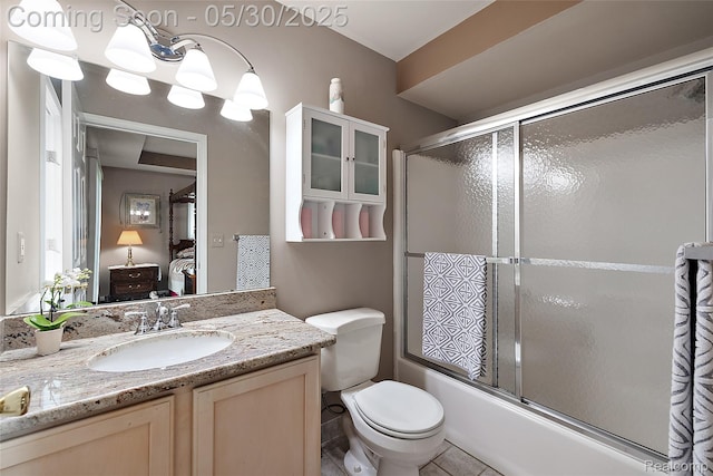 16106 Nathan Dr, Macomb, MI 48044 - ensuite bathroom featuring shower / bath combination with glass door, vanity, toilet, and tile patterned floors