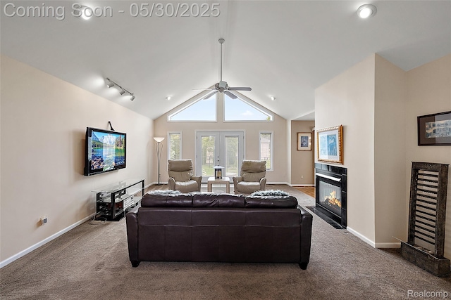 16106 Nathan Dr, Macomb, MI 48044 - carpeted living area with a tiled fireplace, a ceiling fan, baseboards, lofted ceiling, and french doors