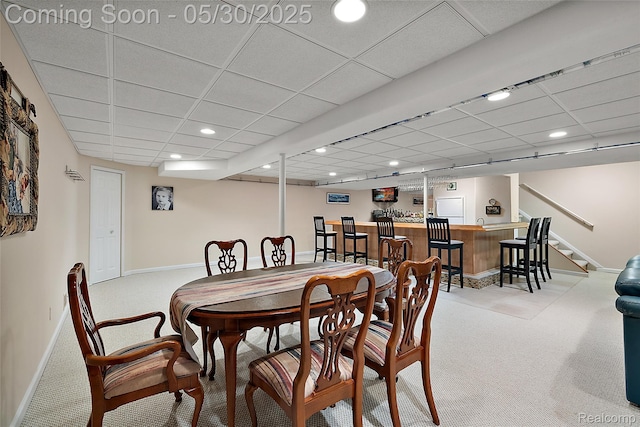 16106 Nathan Dr, Macomb, MI 48044 - carpeted dining room featuring bar with sink, a drop ceiling, baseboards, recessed lighting, and stairs