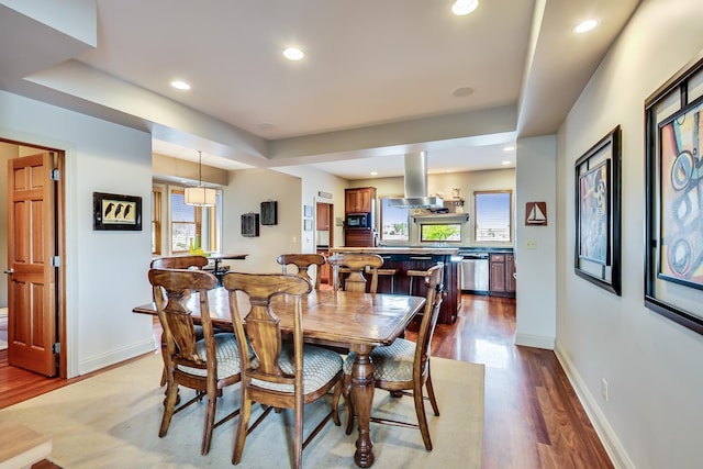210 E Water St, New Buffalo, MI 49117 - dining space with healthy amount of natural light, wood finished floors, baseboards, and recessed lighting