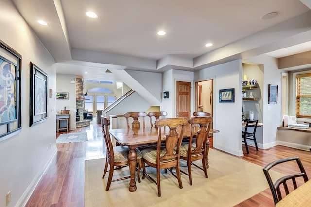210 E Water St, New Buffalo, MI 49117 - dining area featuring light wood-type flooring, plenty of natural light, baseboards, recessed lighting, and ornate columns