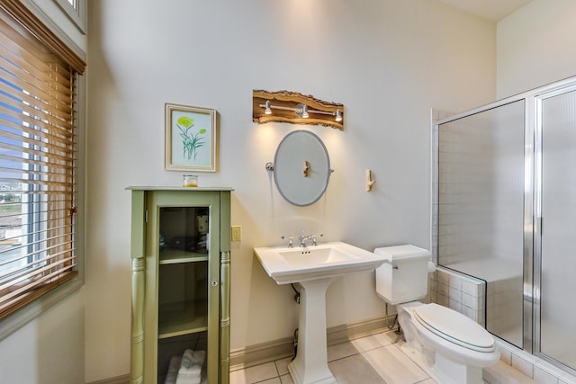 210 E Water St, New Buffalo, MI 49117 - full bathroom featuring toilet, tile patterned floors, a stall shower, and baseboards