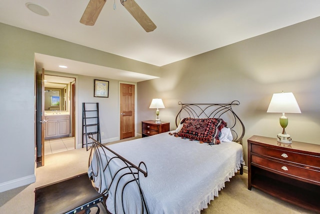 210 E Water St, New Buffalo, MI 49117 - carpeted bedroom featuring baseboards, ensuite bath, and a ceiling fan