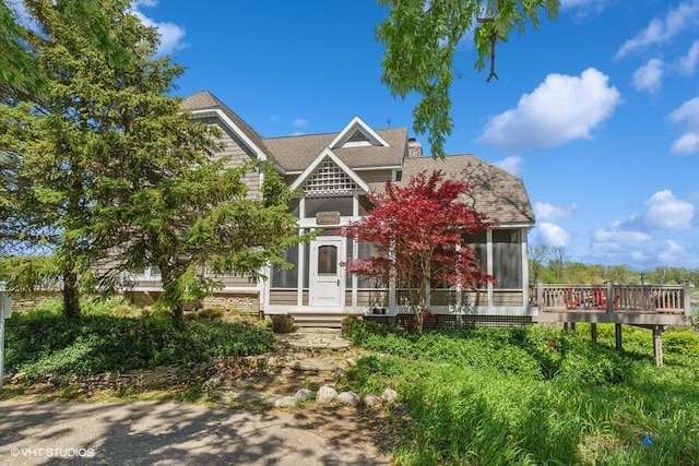 210 E Water St, New Buffalo, MI 49117 - view of front facade featuring a sunroom
