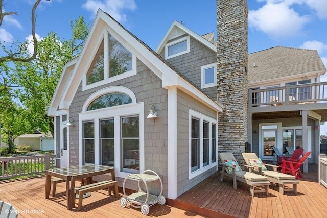 210 E Water St, New Buffalo, MI 49117 - back of property featuring a chimney and a deck