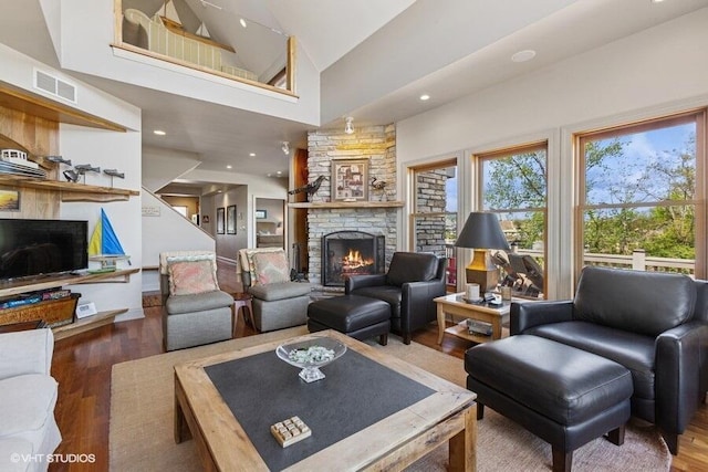 210 E Water St, New Buffalo, MI 49117 - living room featuring healthy amount of natural light, a fireplace, wood finished floors, high vaulted ceiling, and recessed lighting