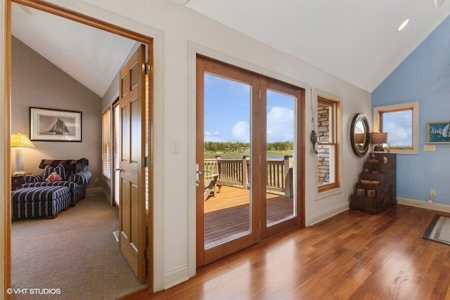 210 E Water St, New Buffalo, MI 49117 - doorway to outside featuring baseboards, wood finished floors, and high vaulted ceiling