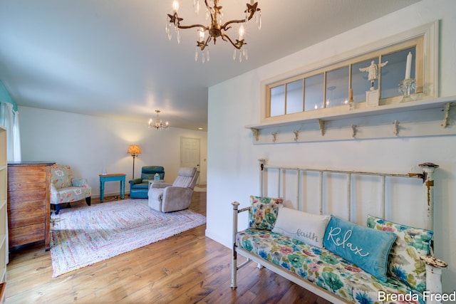 7561 Wiczer Dr, Whitehall, MI 49461 - living area with a chandelier and hardwood / wood-style flooring