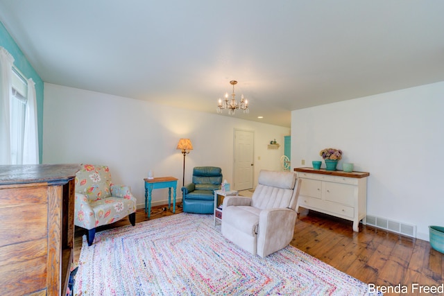 7561 Wiczer Dr, Whitehall, MI 49461 - sitting room with wood finished floors, a chandelier, and baseboards