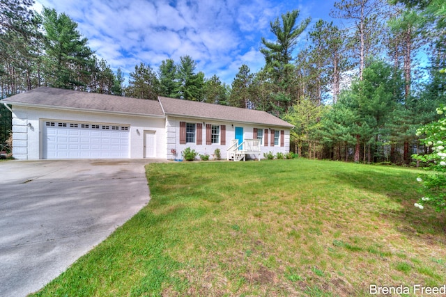 7561 Wiczer Dr, Whitehall, MI 49461 - ranch-style house with an attached garage, driveway, and a front yard