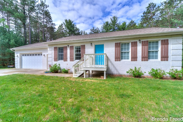 7561 Wiczer Dr, Whitehall, MI 49461 - ranch-style house featuring driveway, a garage, brick siding, and a front lawn