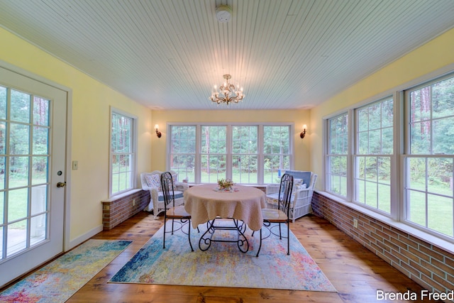 7561 Wiczer Dr, Whitehall, MI 49461 - dining room featuring a chandelier and wood-type flooring