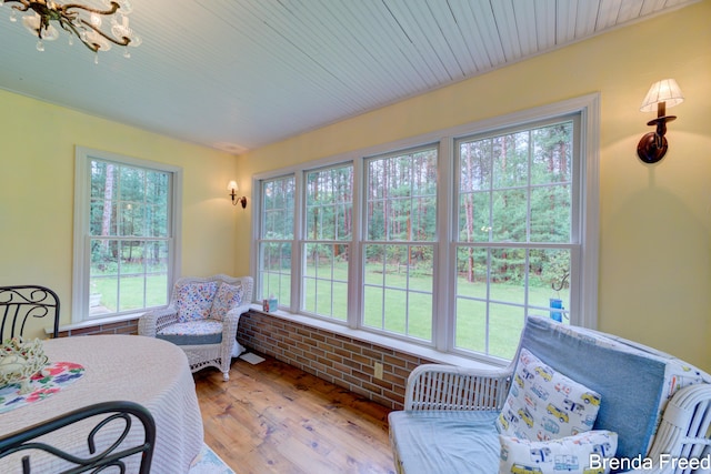 7561 Wiczer Dr, Whitehall, MI 49461 - sunroom / solarium featuring plenty of natural light and a chandelier