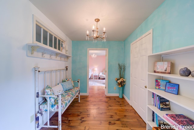 7561 Wiczer Dr, Whitehall, MI 49461 - hall with a chandelier and wood finished floors