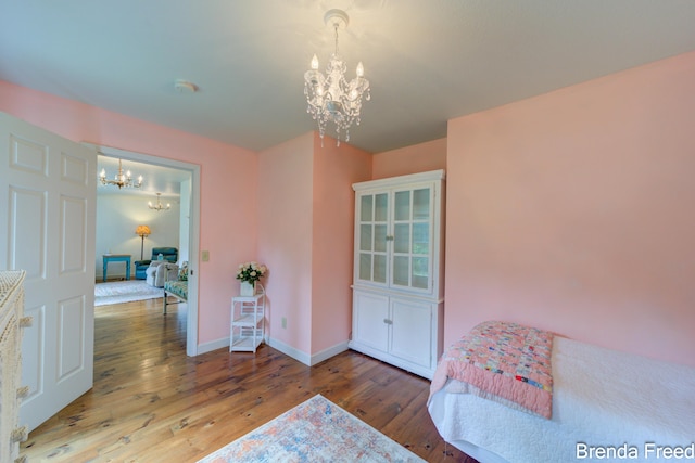 7561 Wiczer Dr, Whitehall, MI 49461 - foyer with a chandelier, wood finished floors, and baseboards